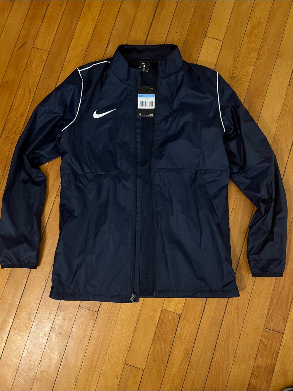 Nike Men's Navy Windbreaker with White Swoosh and Piping